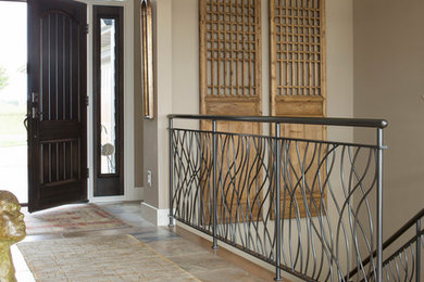 Entryway - transitional entryway idea in Minneapolis with beige walls and a dark wood front door