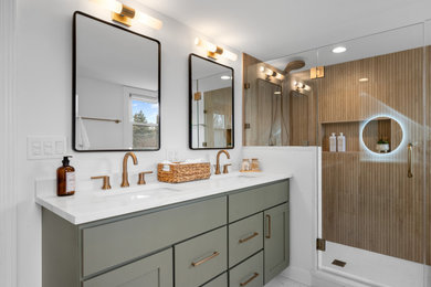 Large transitional master brown tile and porcelain tile porcelain tile, white floor and double-sink corner shower photo in Chicago with shaker cabinets, green cabinets, a one-piece toilet, white walls, an undermount sink, quartz countertops, a hinged shower door, white countertops, a niche and a built-in vanity