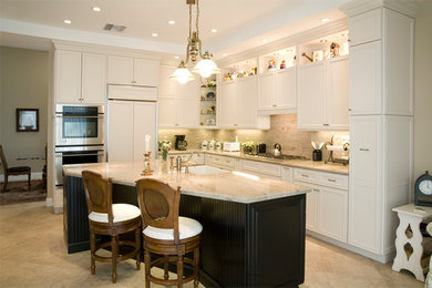 Eat-in kitchen - large transitional beige floor and ceramic tile eat-in kitchen idea in Other with a farmhouse sink, recessed-panel cabinets, white cabinets, beige backsplash, stainless steel appliances and an island
