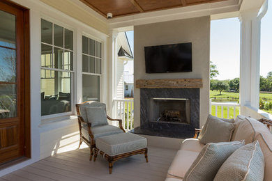 Elegant back porch photo in Charleston with decking and a roof extension