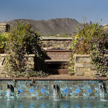 Mediterranean Stone Pool With Blue Tiled Waterfall