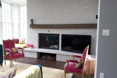 Mid-sized eclectic open concept dark wood floor and brown floor living room photo in Montreal with gray walls, a standard fireplace and a wood fireplace surround