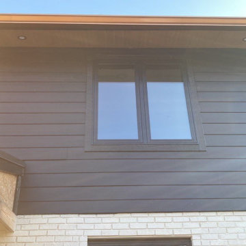 Modern Exterior Transformation with Metal Roofing & James Hardie Siding in Highl