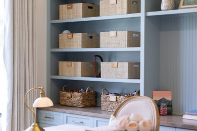 Home office - french country freestanding desk medium tone wood floor and brown floor home office idea in Other with beige walls