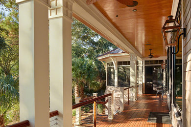 Large arts and crafts back porch idea in Charleston with a roof extension
