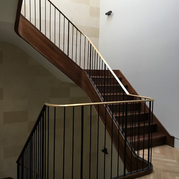 Walnut Stairs with Bronze Handrail and Iron Balusters