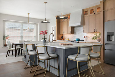 Large transitional galley ceramic tile and beige floor eat-in kitchen photo in Austin with shaker cabinets, medium tone wood cabinets, quartz countertops, quartz backsplash, stainless steel appliances, an island, beige backsplash and beige countertops