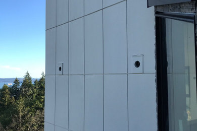 Inspiration for a large three-story mixed siding house exterior remodel in Vancouver