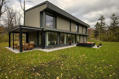 Example of a minimalist exterior home design in Montreal