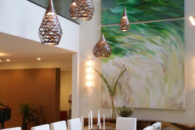 Great room - large tropical great room idea in Hawaii with beige walls and no fireplace