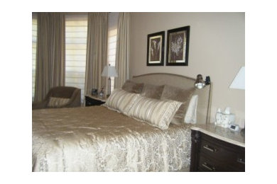 Example of a small transitional master carpeted bedroom design in Charlotte with beige walls
