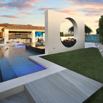 Modern Infinity Pool, Elevated Spa, Outdoor Kitchen, and Unique Fire Structure