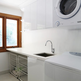 Mid-sized trendy single-wall dedicated laundry room photo in Brisbane with an undermount sink, flat-panel cabinets, white cabinets and white countertops