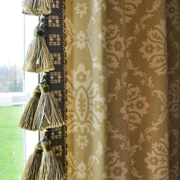 Kitchen with panels and shade with fabric and matching tassel trim.