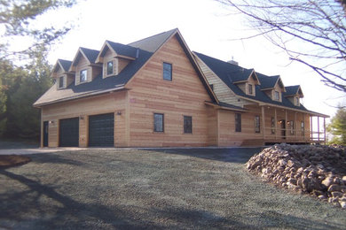 Inspiration for a mid-sized rustic beige two-story wood exterior home remodel in Other with a shingle roof