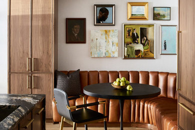 Trendy light wood floor and beige floor breakfast nook photo in Chicago with white walls