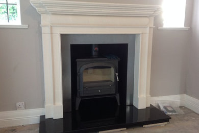Acquisitions Lincoln Limestone fireplace with Bloomsbury Gunmetal Stove