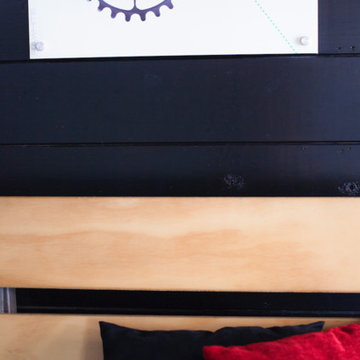 Plywood bench and black wood slat wall