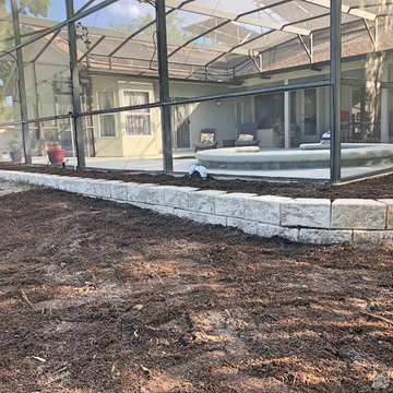 Retaining wall to prevent erosion and create planting beds