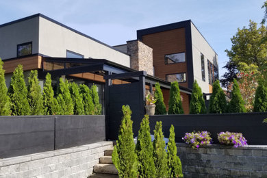 Example of a mid-sized trendy exterior home design in Toronto