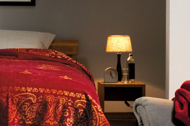 Example of a zen bedroom design in Charlotte