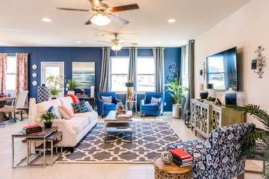 Inspiration for a contemporary open concept living room remodel in Austin with blue walls, no fireplace and a wall-mounted tv