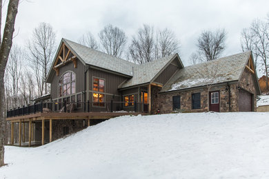 Large mountain style gray two-story mixed siding exterior home photo in Other with a tile roof
