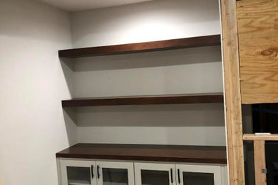 Custom kitchen and bookcases in the basement