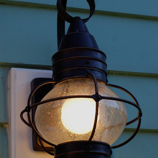 Design ideas for a mid-sized industrial backyard patio in Indianapolis with a fire feature, concrete slab and a pergola.