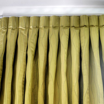 Inverted pleat curtains on decorator track