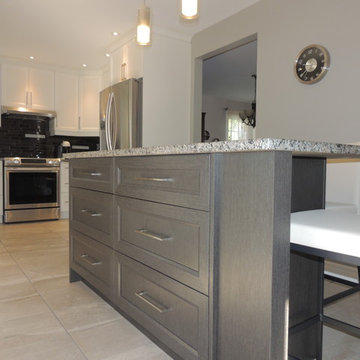 White polyester kitchen with functional dark island