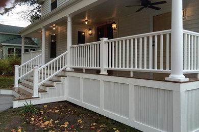 Example of a mid-sized classic white two-story wood exterior home design in New York