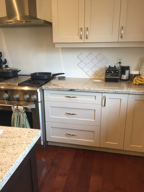 White tile backsplash with beige cabinets??