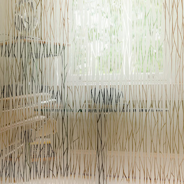 Three Story Stairwell With An Etched Glass Wall in Glen Allen