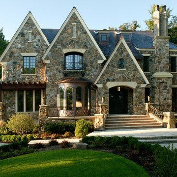 Stone Home with Copper Bay and Fireplace on Front Elevation