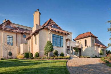 Example of a tuscan exterior home design in Charlotte