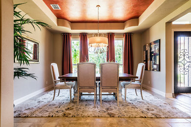 Inspiration for a large mediterranean ceramic tile enclosed dining room remodel in Austin with beige walls