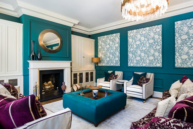 Inspiration for a large classic formal enclosed living room in Other with blue walls, light hardwood flooring, a standard fireplace, a stone fireplace surround, a concealed tv, panelled walls and a chimney breast.