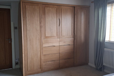 Photo of a medium sized contemporary built-in wardrobe in West Midlands.