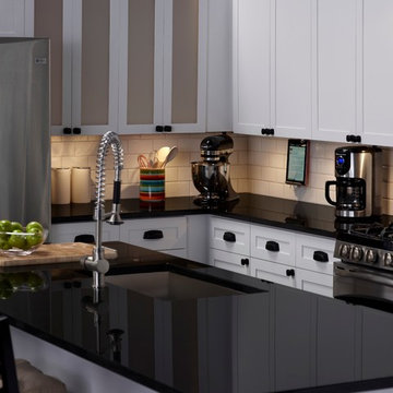 adorne® Modular Track installed under cabinets with adorne® Outlet Modules and a