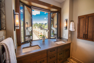 Design ideas for a large country master bathroom in Albuquerque with shaker cabinets, medium wood cabinets, a double shower, beige walls, an undermount sink, engineered quartz benchtops, a hinged shower door, brown benchtops, a double vanity and a built-in vanity.