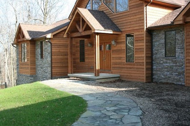 Inspiration for a mid-sized craftsman multicolored one-story mixed siding house exterior remodel in Philadelphia