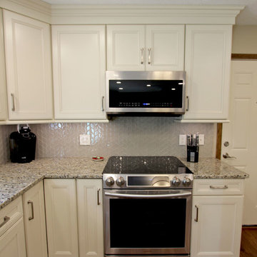 Cream Kitchen with Green Island with Butcher Block Countertop