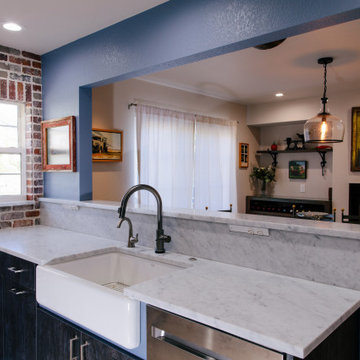 White farmhouse sink with marble counter top
