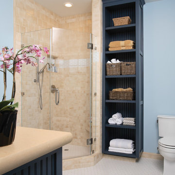 Corner Shower with Blue Cabinetry