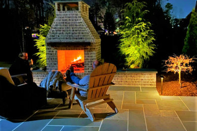Inspiration for a mid-sized modern backyard patio remodel in Atlanta with a fireplace