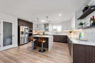 Example of a large arts and crafts u-shaped kitchen design in San Francisco with an island