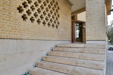 Entry hall - travertine floor entry hall idea in Other