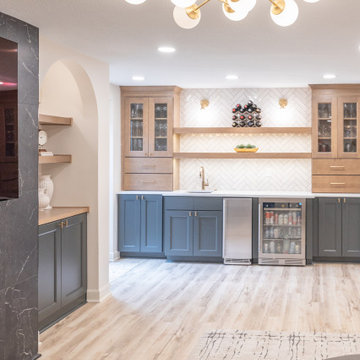 Warm & Inviting Basement Retreat with Custom Bar + Entertainment Center