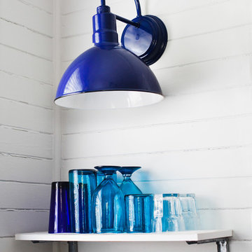 Porcelain Wall Sconce Illuminates Open Shelving in Kitchen Design